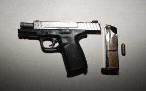 Police arrest two on gun charges