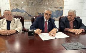 Mayor DaSilva joined by Council President and Vice President Rodericks and Rego to sign ordinance into law