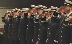 Fire Service Promotion members salute 