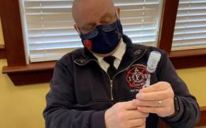 East Providence Battalion Chief Michael Carey prepares dosages of COVID-19 Vaccine. Carey and the East Providence Emergency Management Agency team will begin providing vaccines to East Providence school teachers and staff and East Providence residents living in congregate living facilities. 