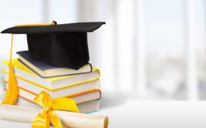 Scholarship image - graduation hat with books and diploma
