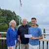    Photo Caption: Mary Chace, Friends of Pomham Rocks Lighthouse (FPRL) member, Paul R. Williams, Squantum member, and Alex Dias, FPRL Board Chair, at the check presentation at the FPRL annual summer event.